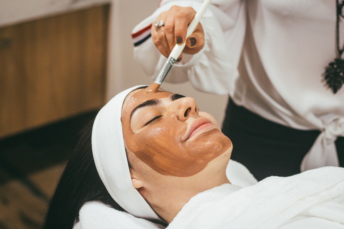 A patient receiving a facial treatment
